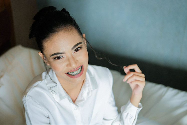 A woman whose Medicare Advantage plan covers her dental services.