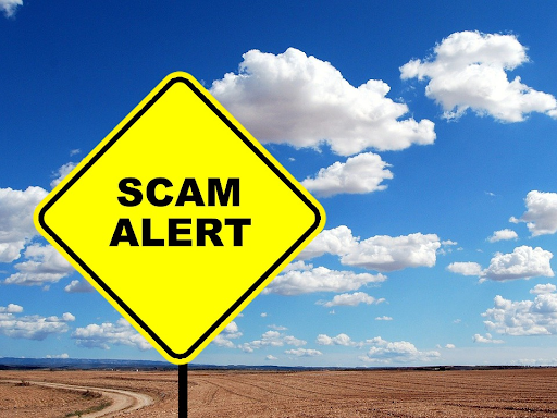 Scam Alert Road Sign