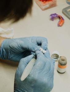 A dentist constructing dentures.