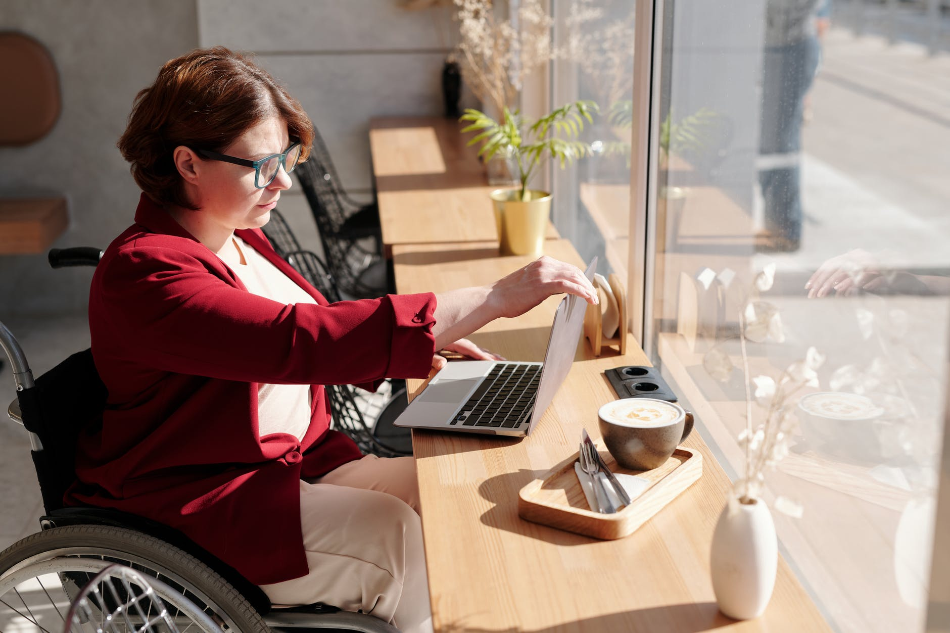 A woman reviewing which insurance plan is best for her