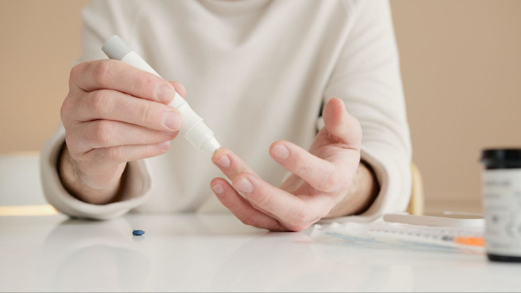 A person with a chronic illness that is covered by Medicare HMO.
