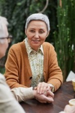 A woman who is happy that she is eligible for Medicare.