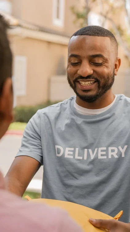 A person who is receiving a package as part of a brushing scam.