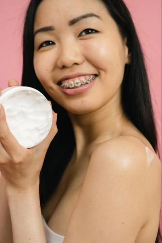 A woman with braces that are covered by Medicare.