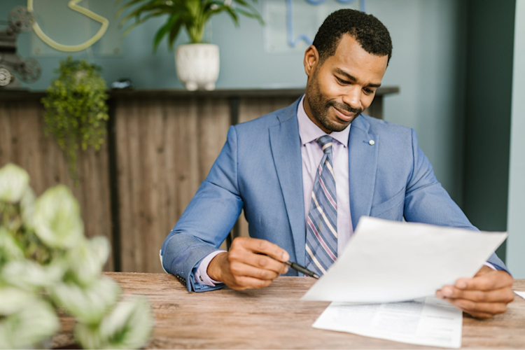 A man signing up for Group Life Insurance.