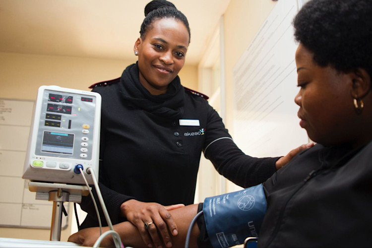 A nurse checking a diabetes patients blood pressure.