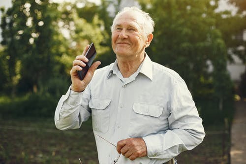 An older person who's just spoke to his Medicare agent about health cover.