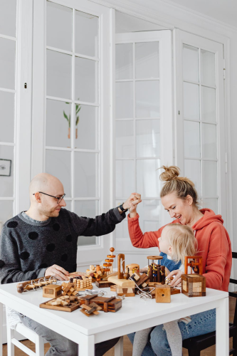 A family that is happy because they can be covered by life insurance even if one of them has cancer.