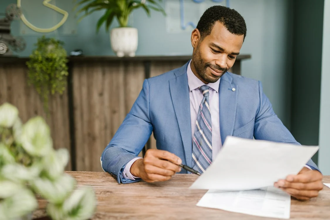 A man looking at the costs of Convertible Term Life Insurance.