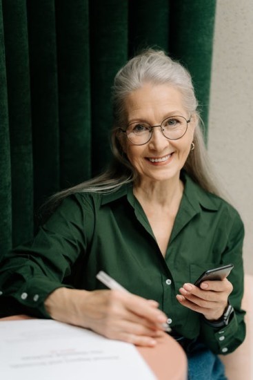An elderly woman that is reviewing her Medicare Supplement Plan.
