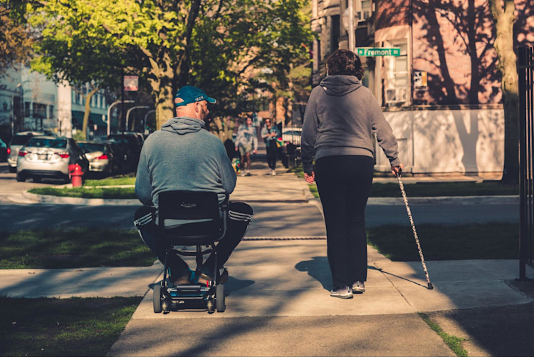 A man whose powered wheelchair is covered by Medicare.