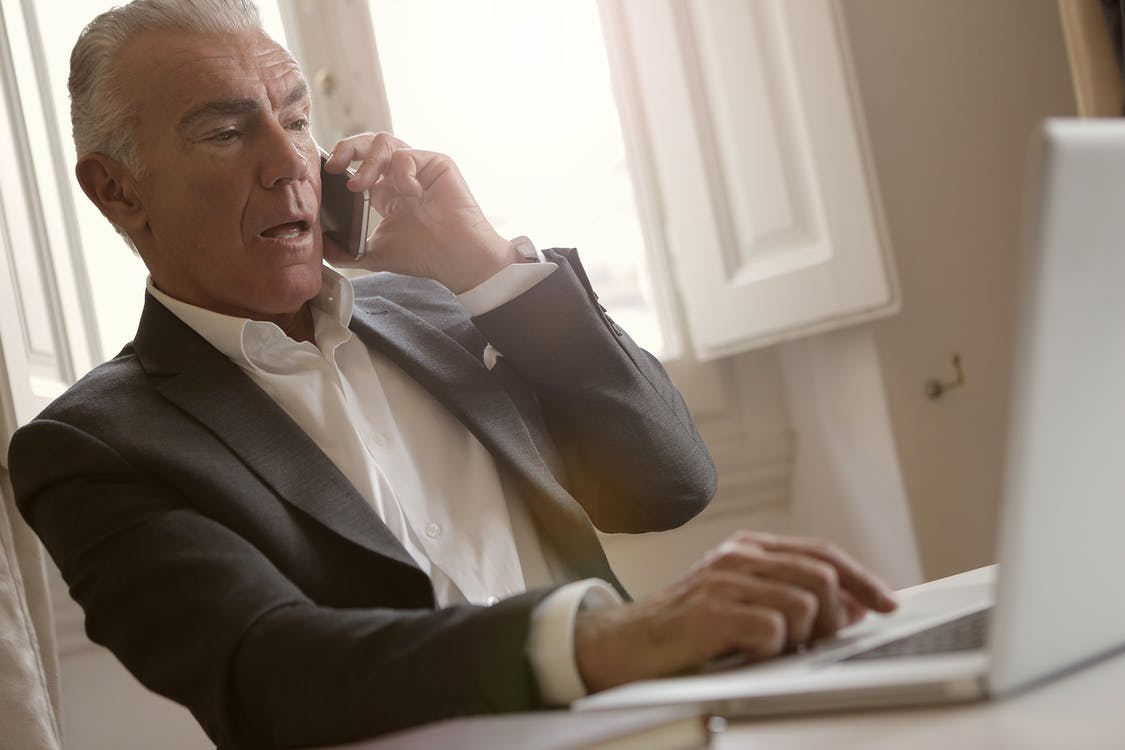 A man on the phone trying to return a package he received as part of a brushing scam.