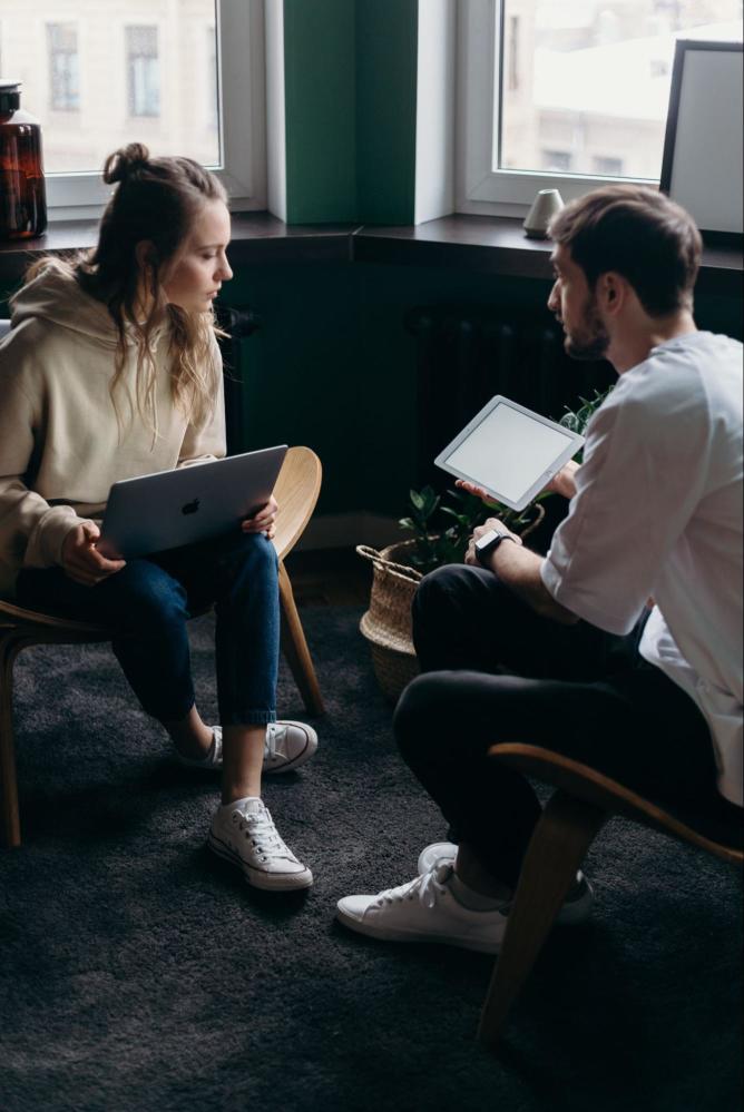 A young couple viewing what the pros and cons of a Modified Whole Life Insurance Policy are.
