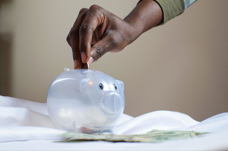 A person who is counting their savings to see if they have enough to pay for their premiums.