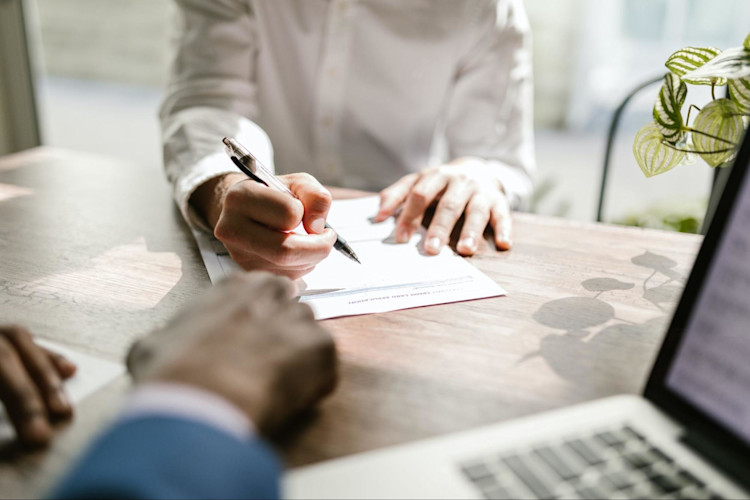 A person signing up for life insurance.