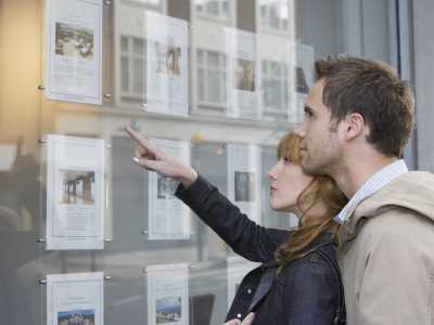 people looking at a house