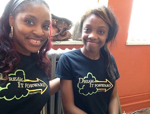 Two women wearing Dream it Forward shirts