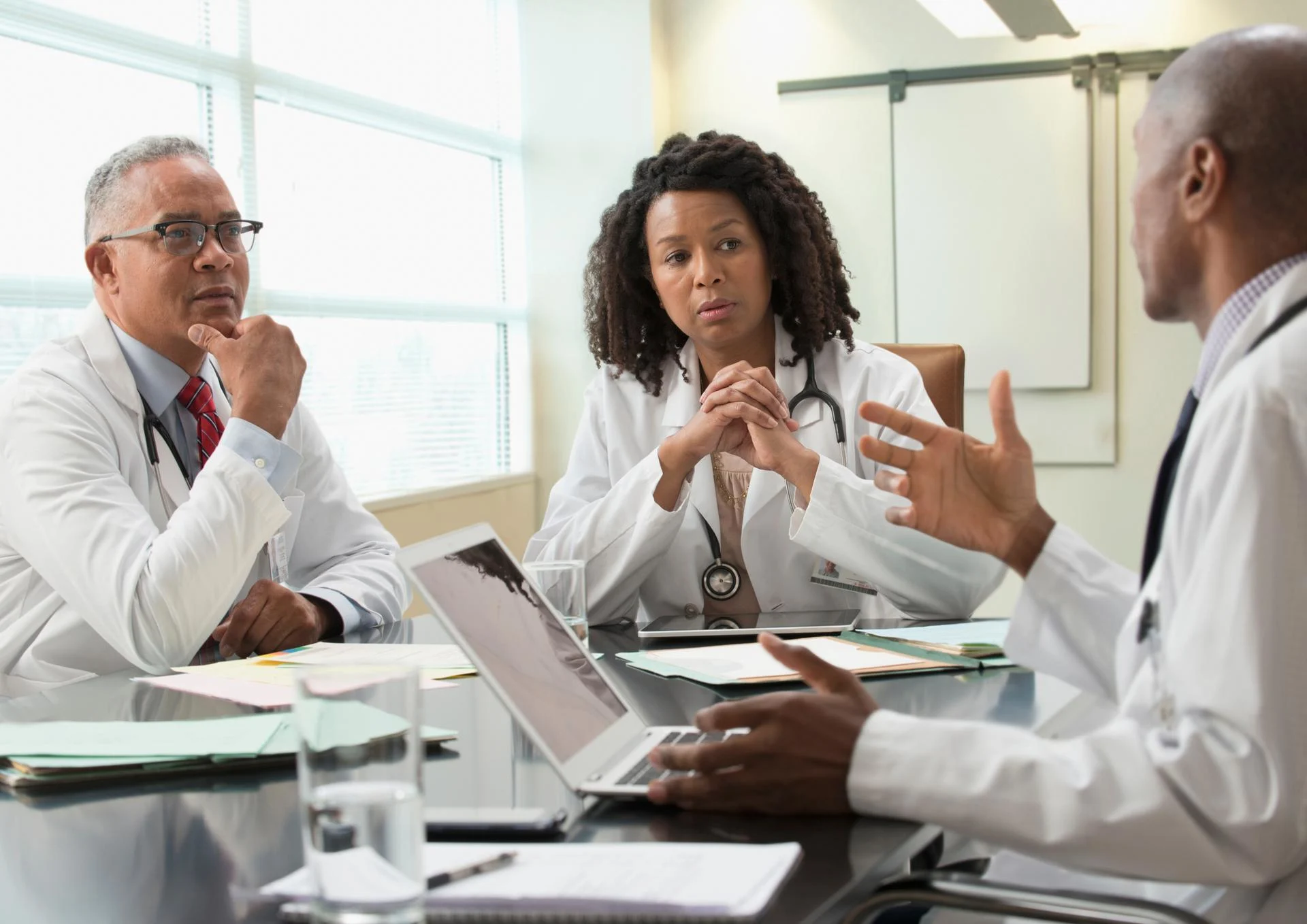 Doctors talking in office meeting