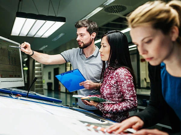 Team looking at computer