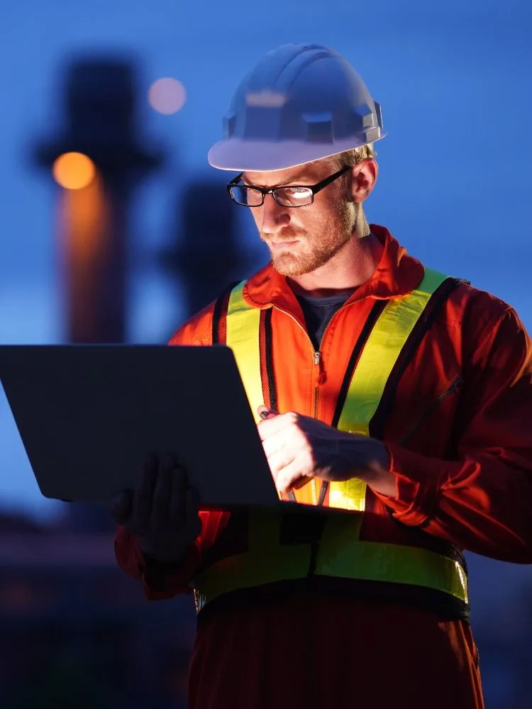 An engineer working with a robot