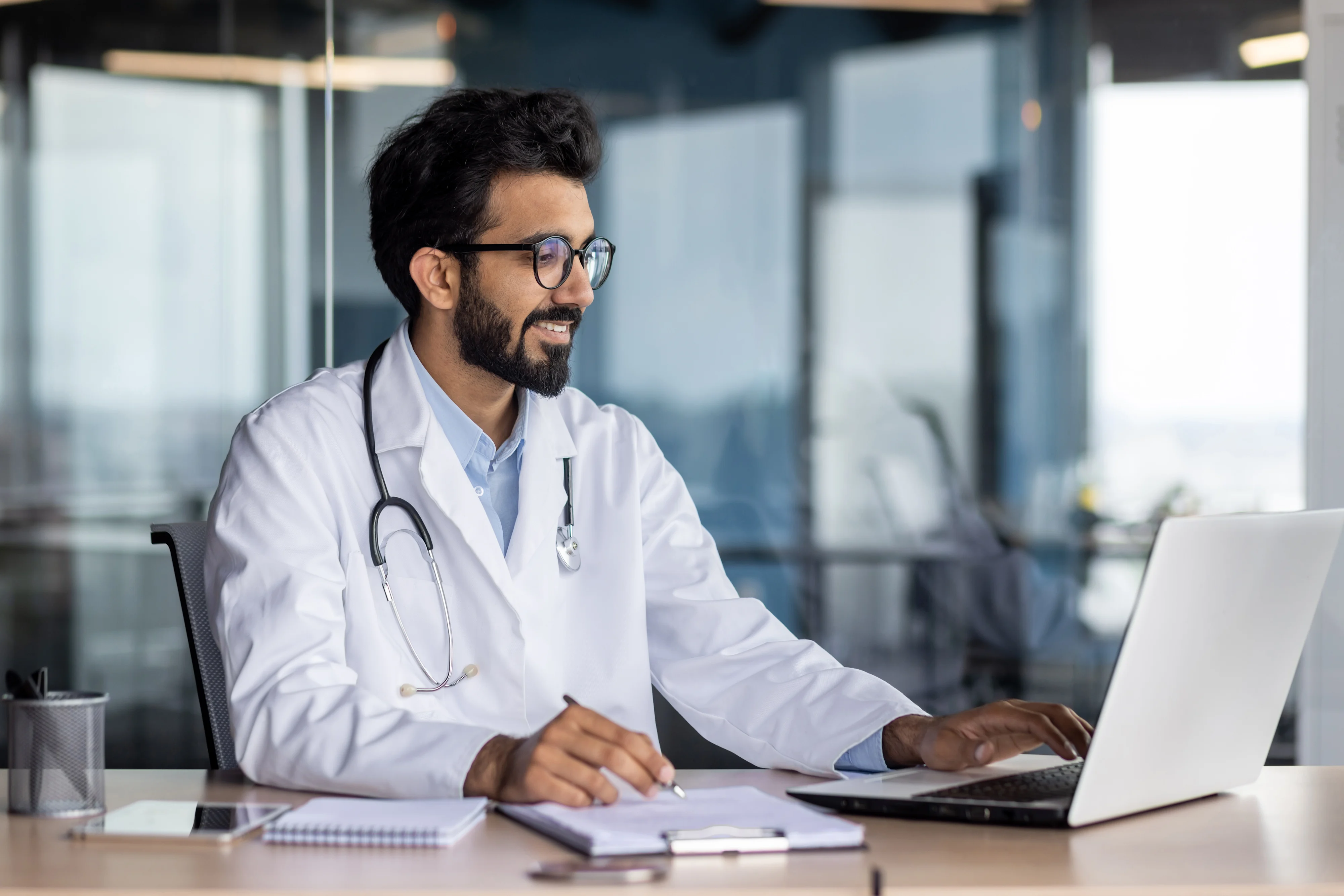 Doctor reading report on Tablet
