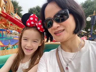Lingni Priestley, a Director of Product Management on Elsevier's ScienceDirect team, enjoys Shanghai Disneyland with her daughter Freya.  