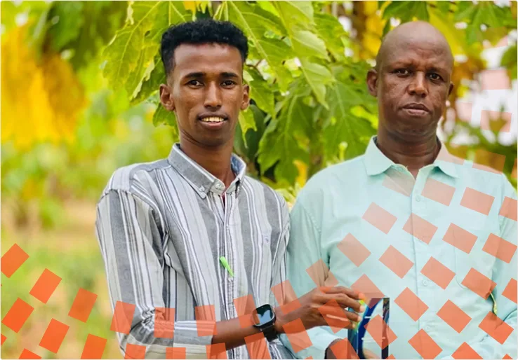 Two men holding an Elsevier Foundation award