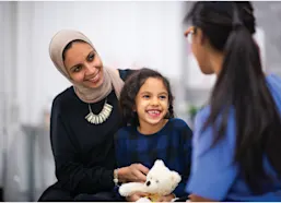 Little girl with her mother at medical appointment