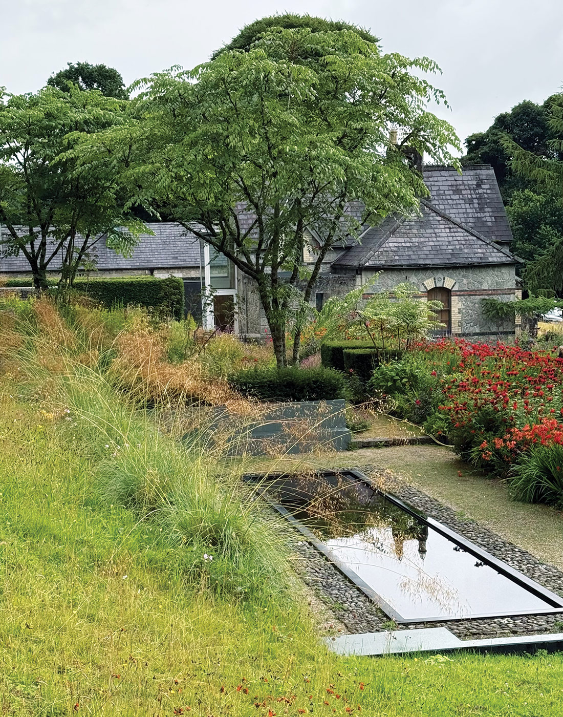 June Blake Garden and water feature in Ireland: Placing pools or ponds away from deciduous trees will help keep them leaf-free. Or, skim them regularly to keep the surface clean.