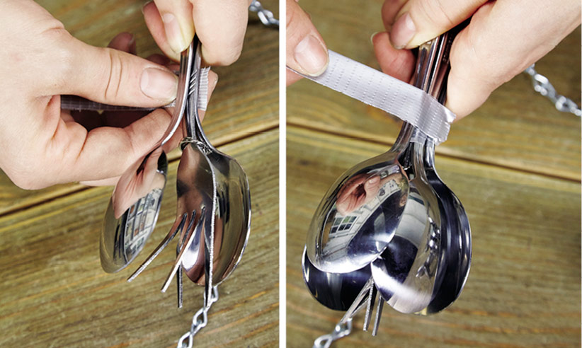 DIY rain chain assembling spoons around forks to create the flower form: Hold each layer in place with duct tape to keep the handles aligned as you work. 