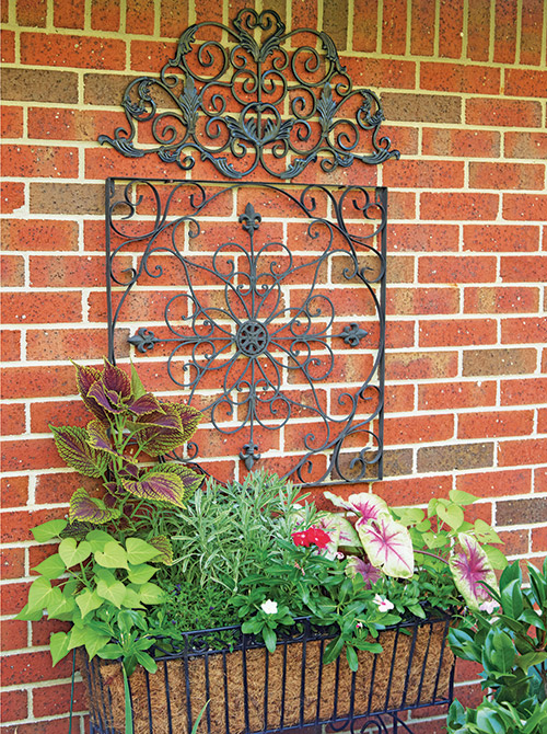 Reader garden container with metal accent: This decorative arrangement evolved over a few years.
