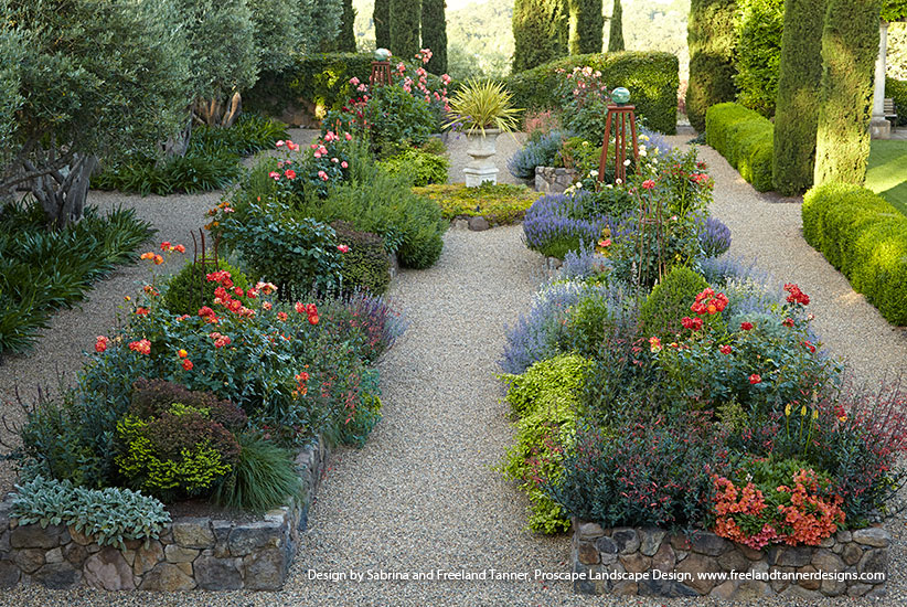 Beautiful stone garden raised beds filled with colorful plants