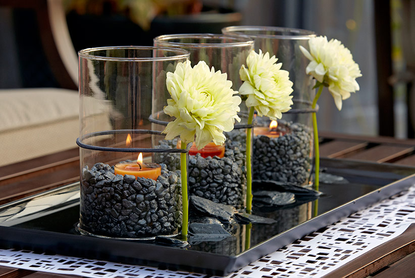 patio-design-idea-tablescape: An elastic hair band secures fresh-cut dahlias to each glass vase.