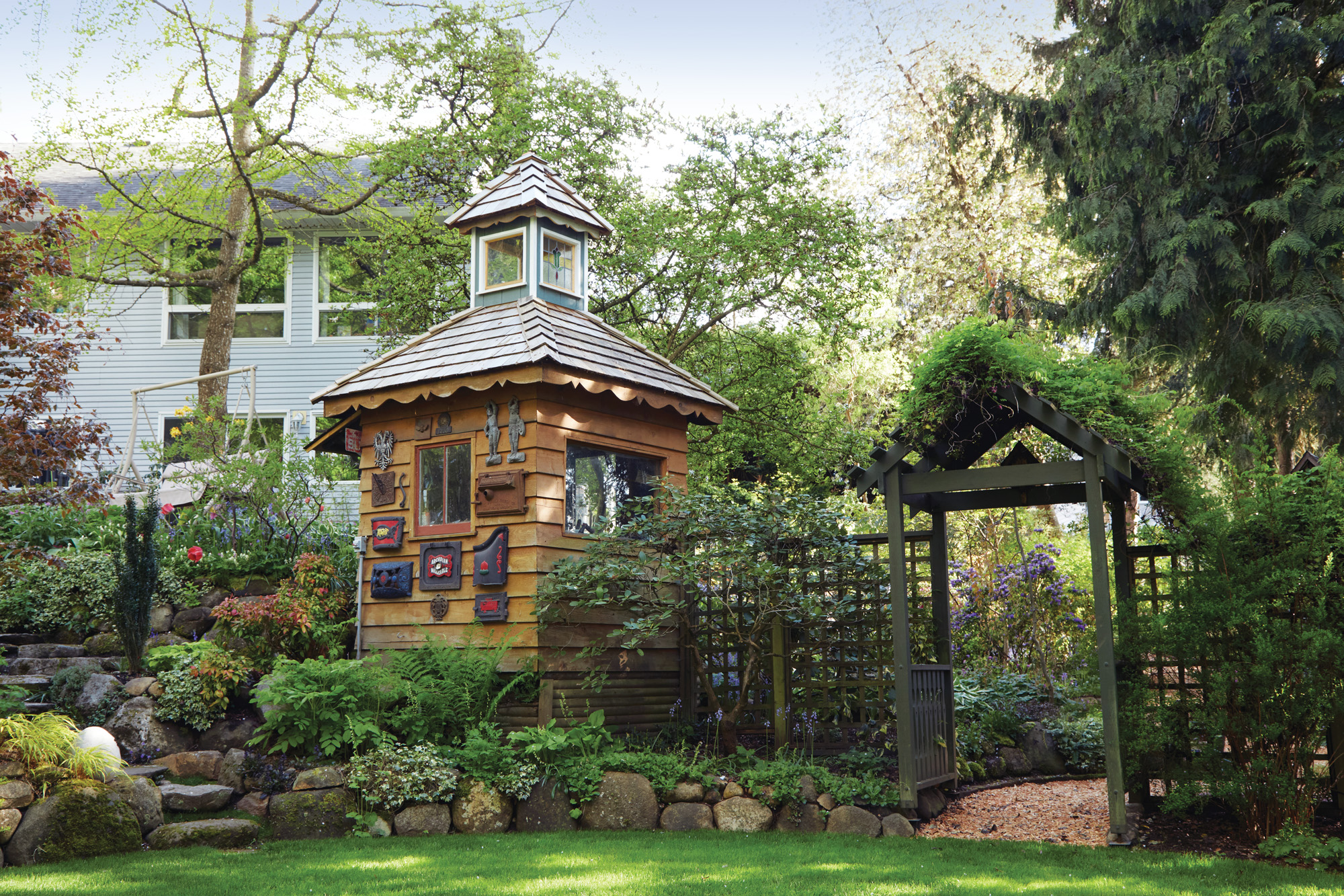 GG186 FG Staunton structures: Once a small gazebo, the now-enclosed tool shed provides a display area for Ted’s cast-iron ornament collection, consisting mostly of old wood-stove oven doors.