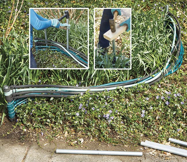 shape edging secure by pounding pipe: Once both ends are set you can begin weaving the additional conduit pipes through the hoses and pounding them in place.