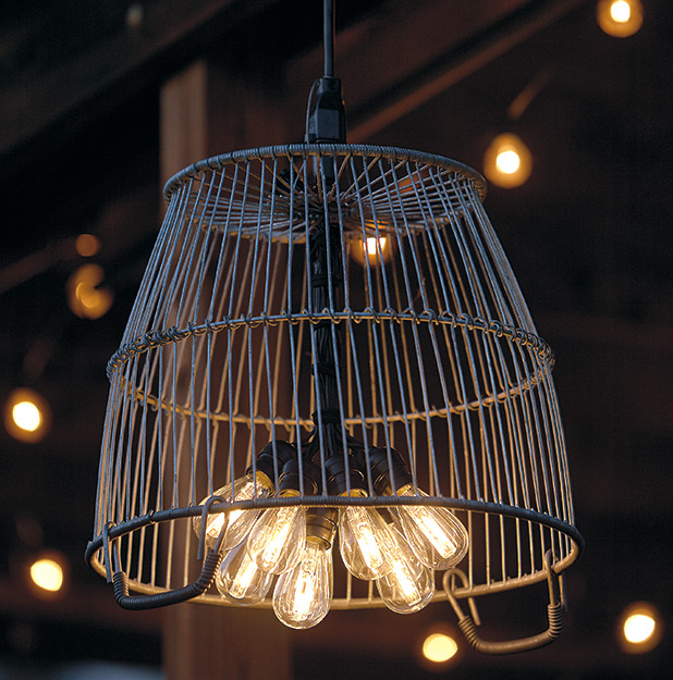 di-garden-chandelier-lead: A metal basket becomes a light shade and adds a touch of farmhouse chic.
