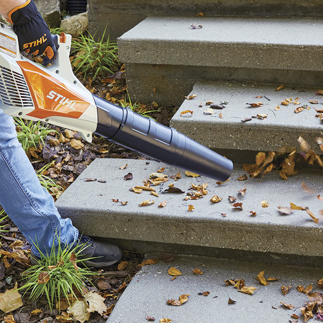 battery-powered-leaf-blower-in-action: Lightweight and cordless, you can go anywhere with this leaf blower.