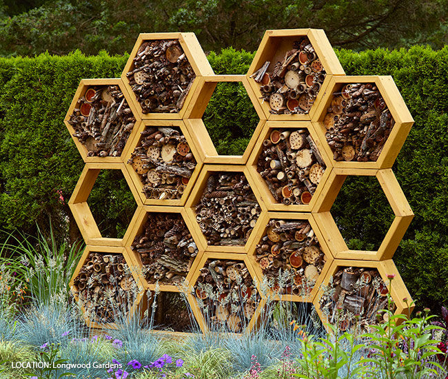 Creative bee house at Longwood gardens: Invite even more hole-nesting pollinator bees with creative bee houses like this one at Longwood Gardens in Pennsylvania.