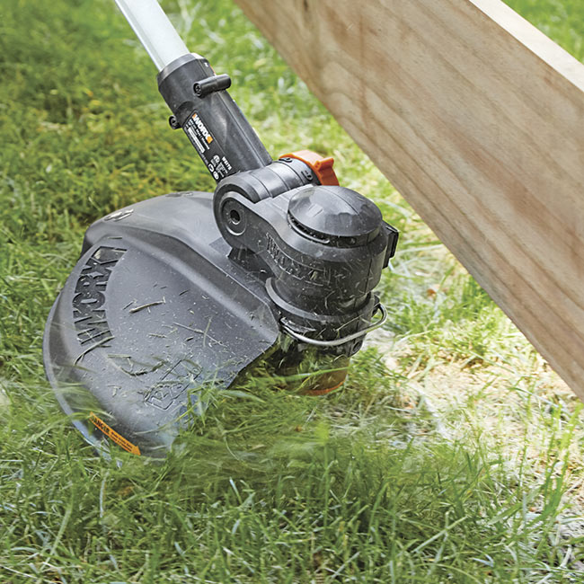 battery-powered-string-trimmer-in-action: WORX batteries can be swapped out for other WORX tools.