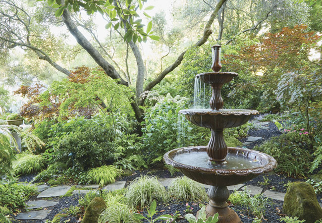 Ruby Andrews tiered fountain: Because this fountain is in a shady part of the yard, Ruby keeps an eye on falling leaves and skims them out of the fountain regularly so the pump doesn’t get clogged.