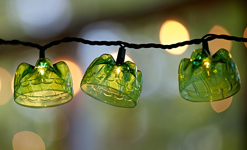 Upcycle plastic bottles into string light covers: Add extra sparkle to your garden with this inexpensive, and simple-to-make, string of lights made from 12-oz. soda bottles. 
