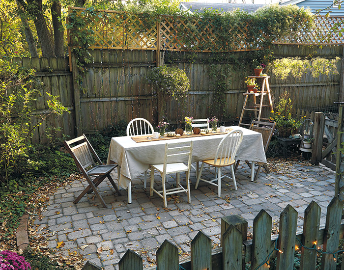 budget-friendly-garden-seating-areaR:  Add extra privacy with a panel of lattice attached to the top of a privacy fence.