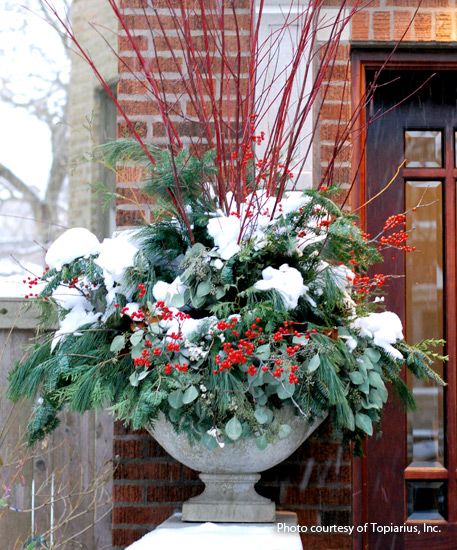 winter-garden-outdoor-arrangement: A seasonal arrangment of evergreens looks beautiful even with a layer of snow!