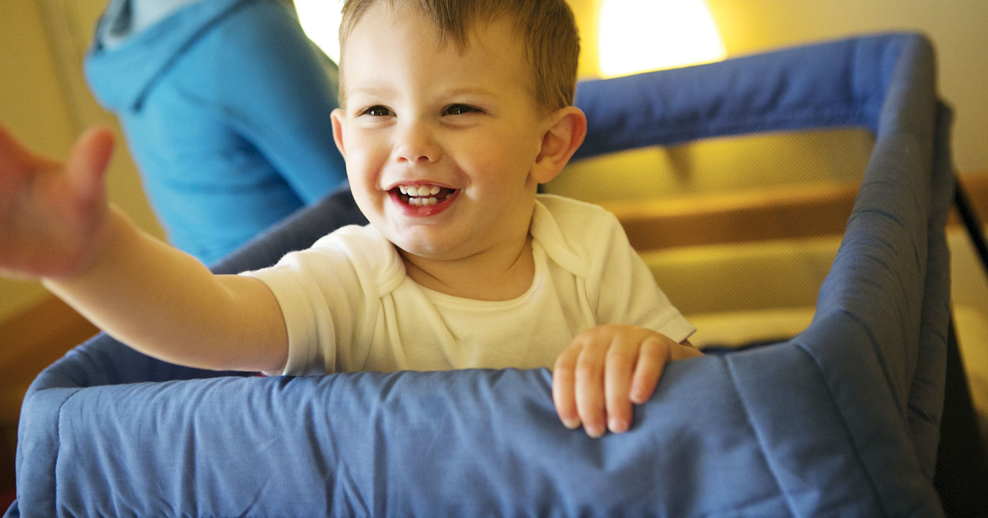 Toddler in his cot in cabin
