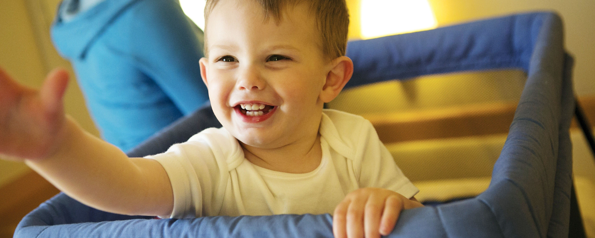 Toddler in his cot in cabin