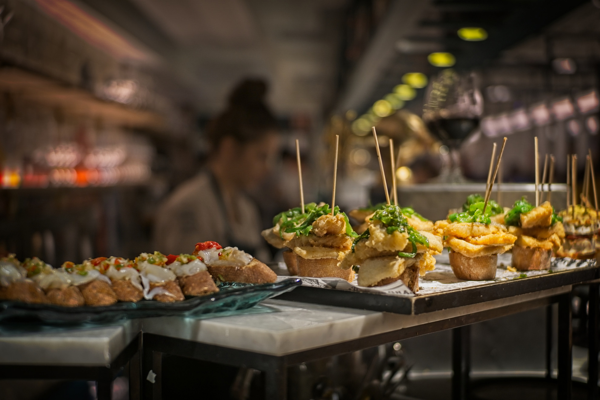 Plates of tapas on a restaurant bar © Shutterstock