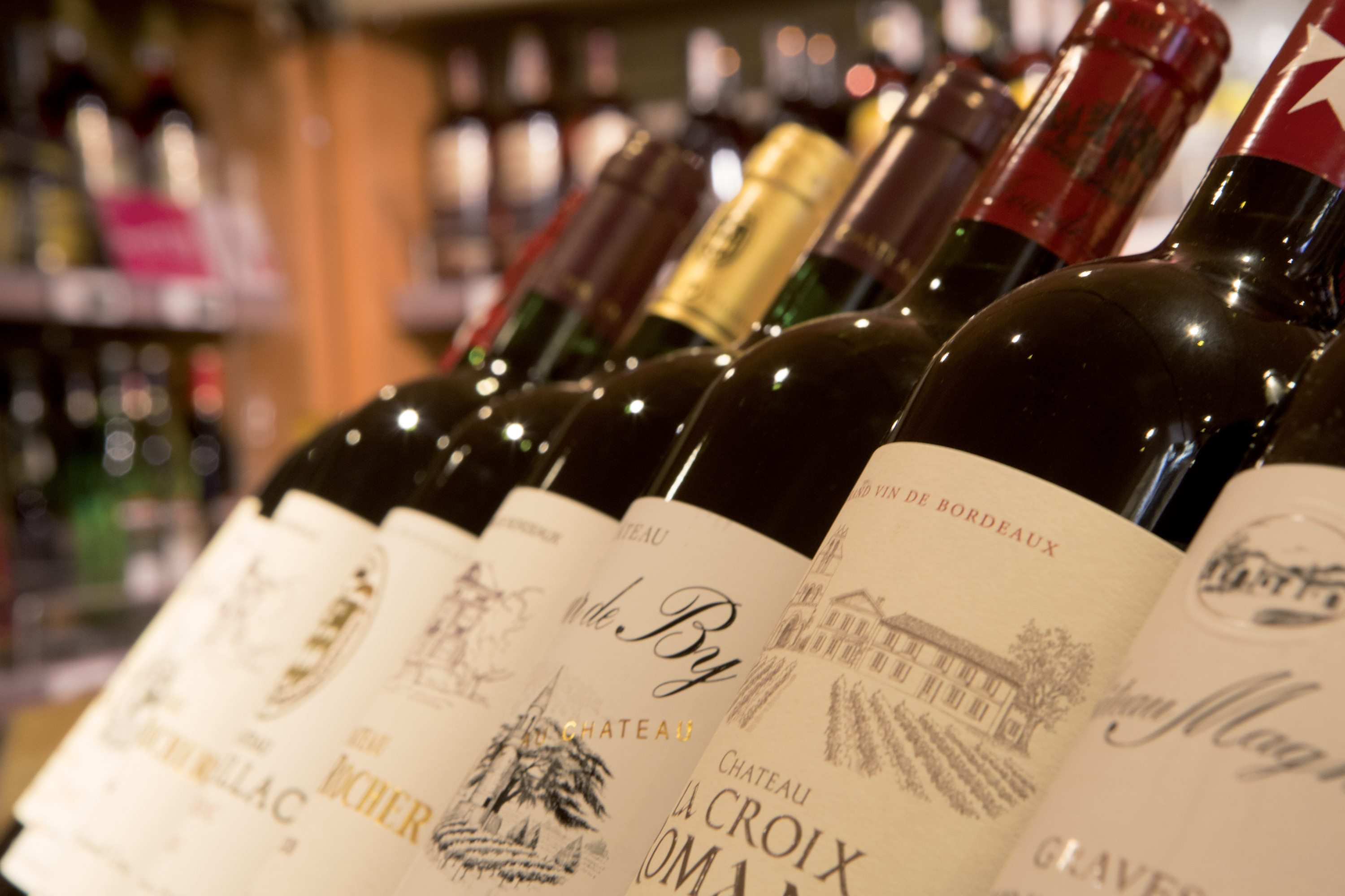 Closeup of red wine bottles
