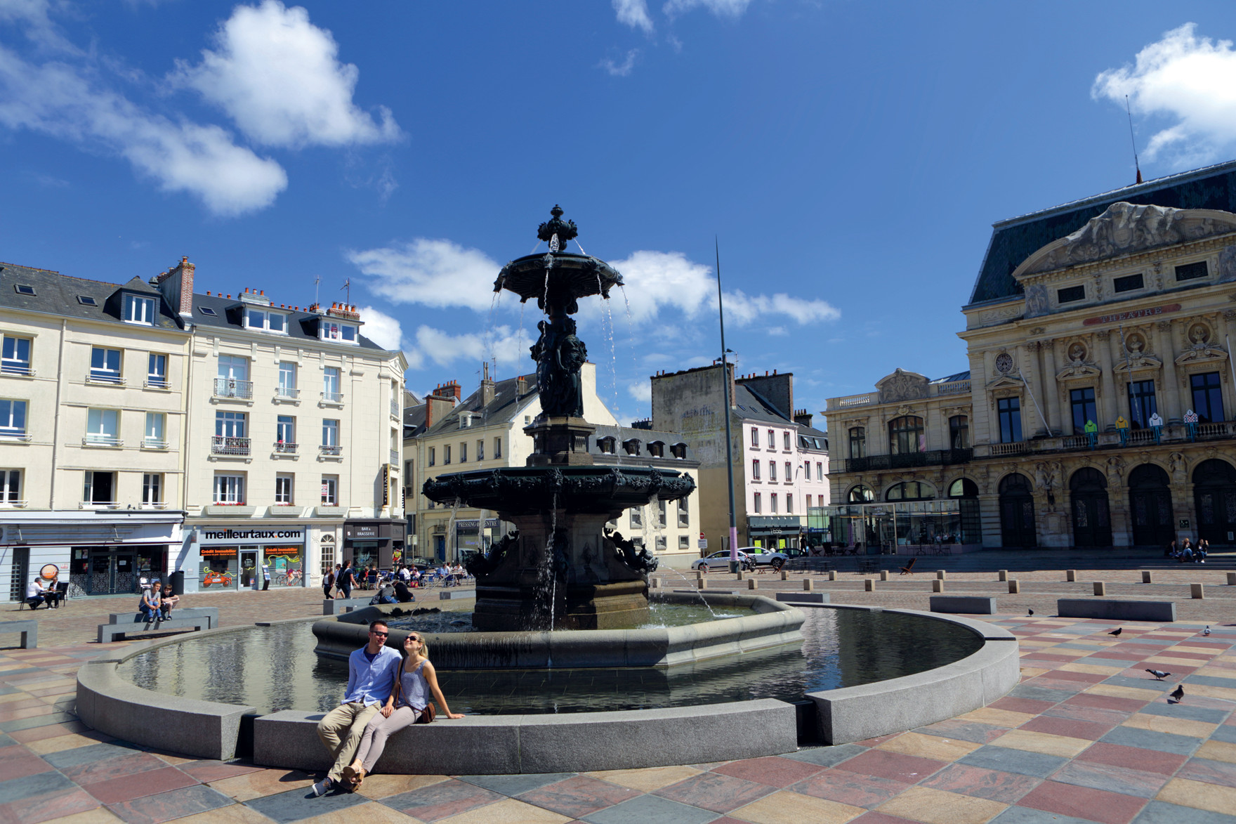 Couple by fountain in Cherbourg
