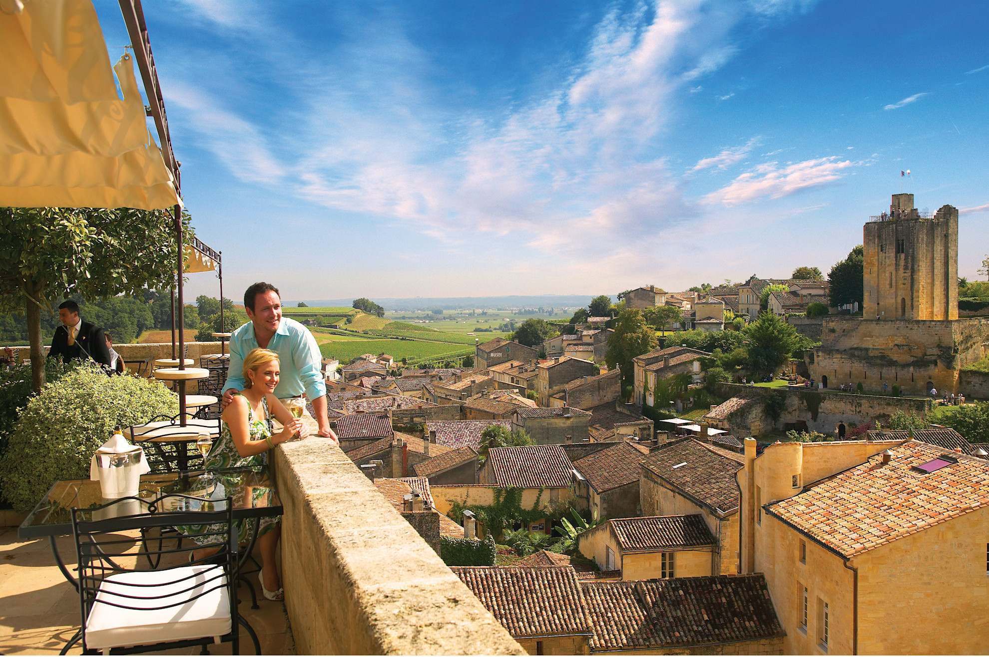 Couple on a balcony overlooking St Emilion