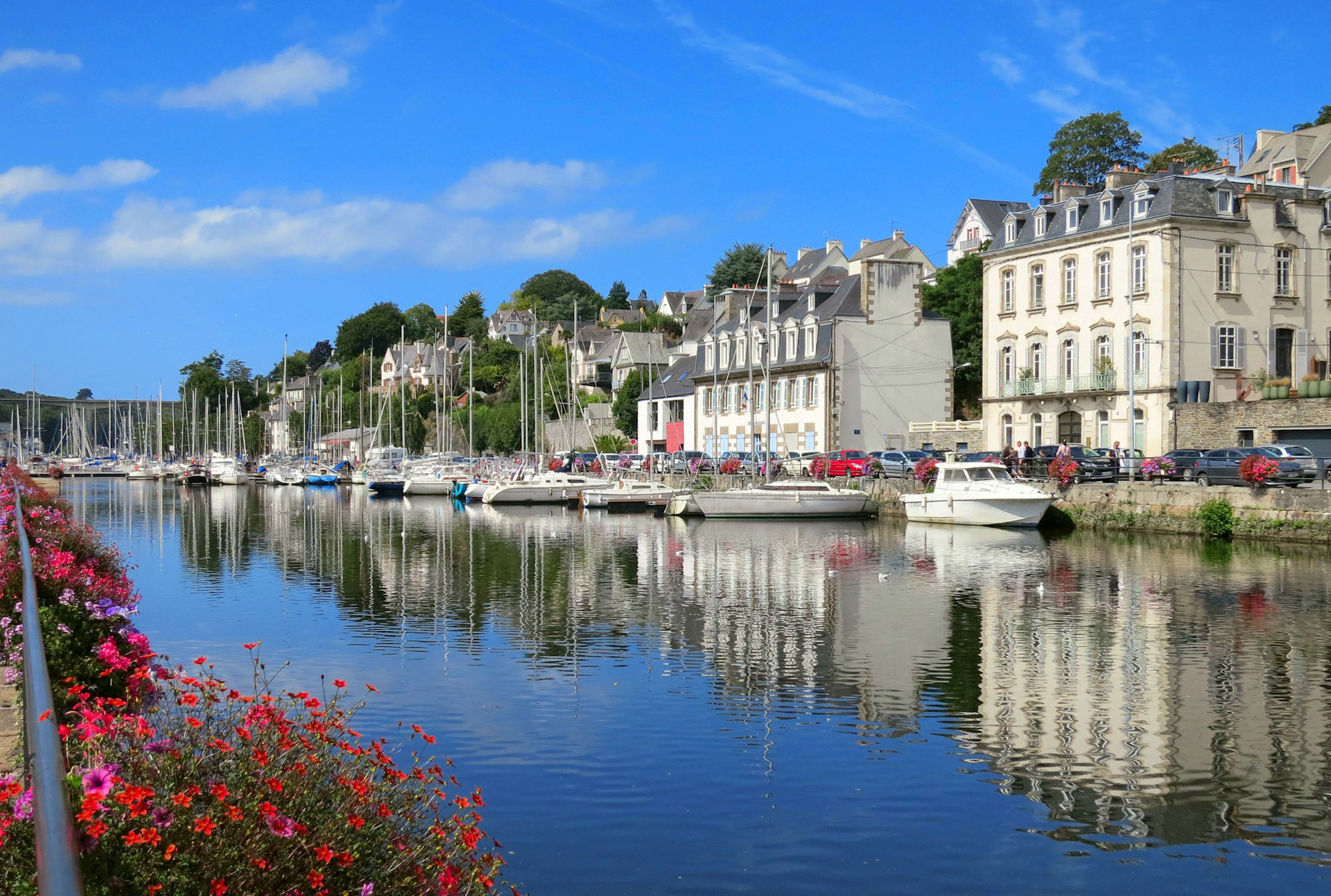 Flowers and boats in Morlaix marina, Brittany, France
